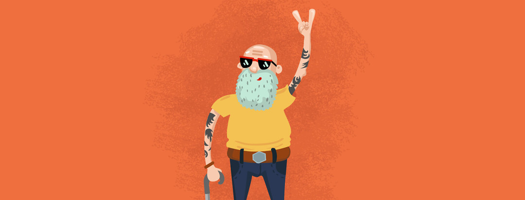 Older man with tattoos on his arms giving a peace sign