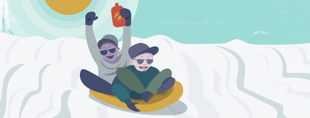 Two men on a sled, one of them has a bottle of sunscreen in their hand