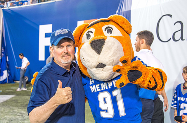 Ken Billett posing with Memphis Tigers mascot.