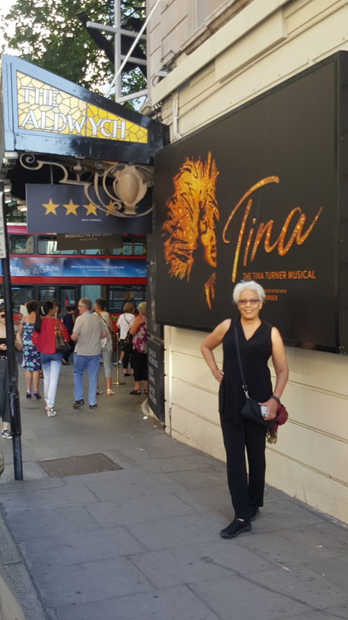 woman stands in front of The Aldwych