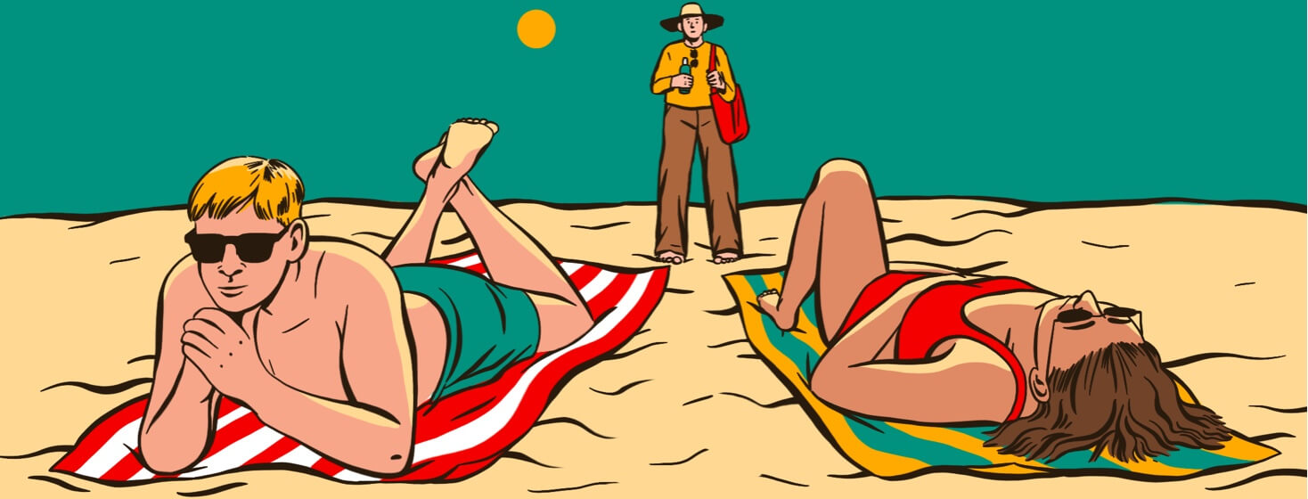 A man on a beach carrying sunscreen looking at two people sunbathing.